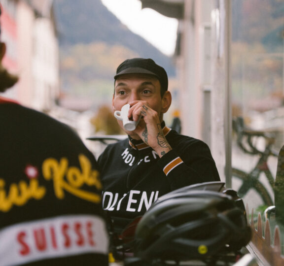 Cyclist drinks an espresso