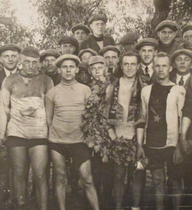 A group of cyclists at an award ceremony after a race